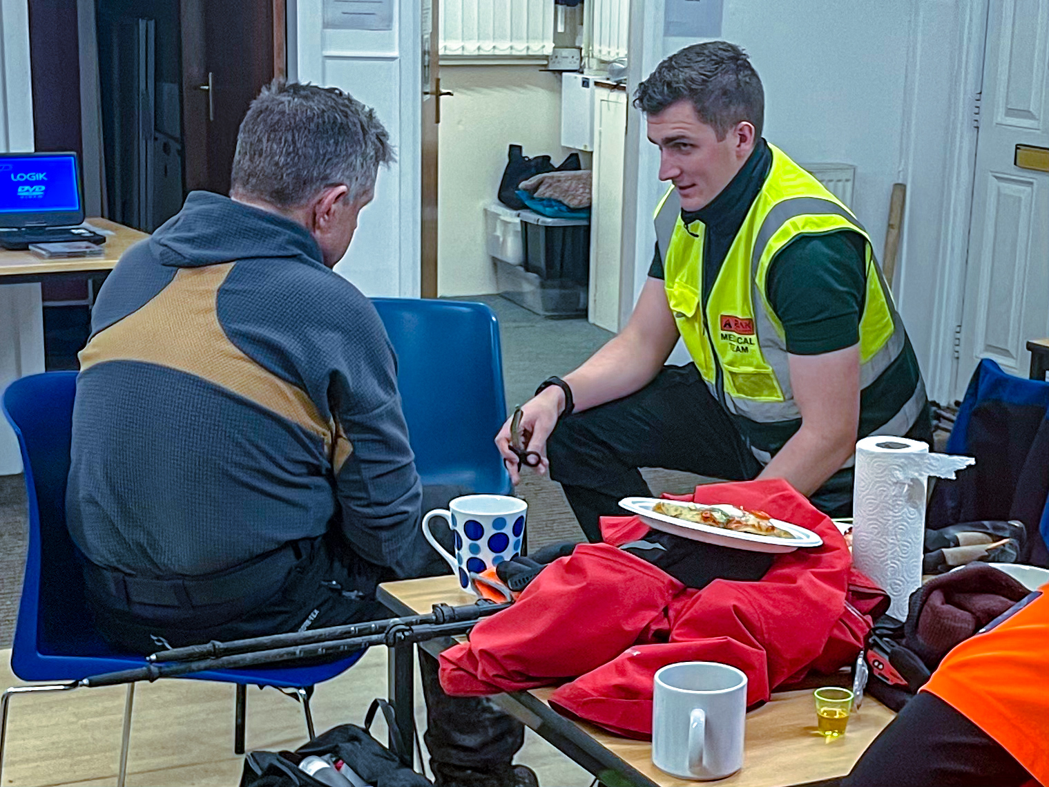 Specialist event medical team providing treatment in a demanding outdoor environment