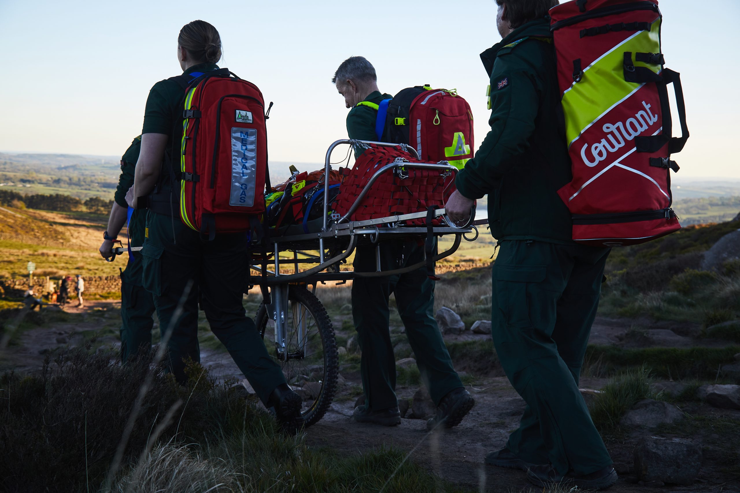 Specialist event medical team providing treatment in a demanding outdoor environment